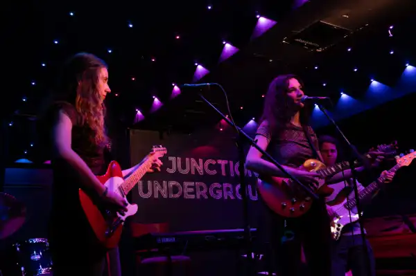 Band playing in red light