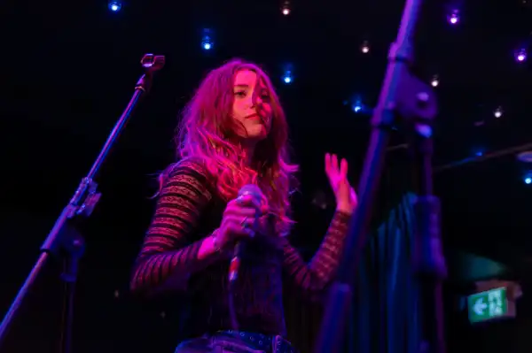 Woman singing in red light
