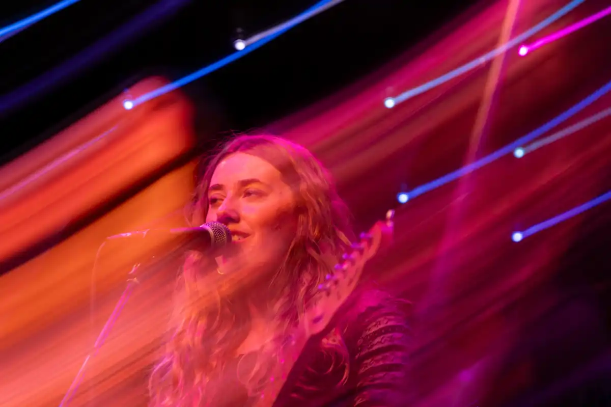 Singer in a red haze of light